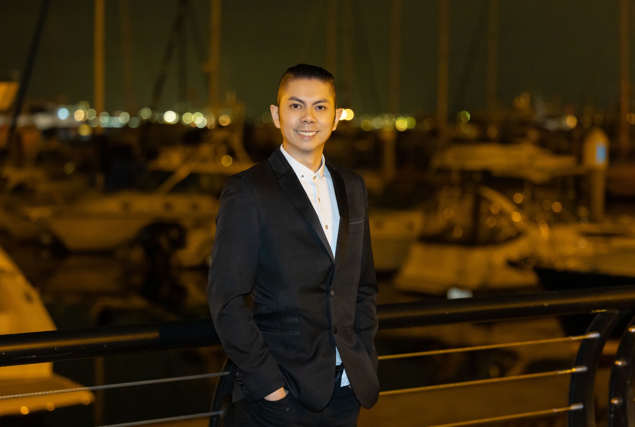 Stanley Xie beside a harbour